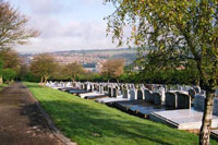 "Jewish Extension Cemetery with headstones to the side of a path"