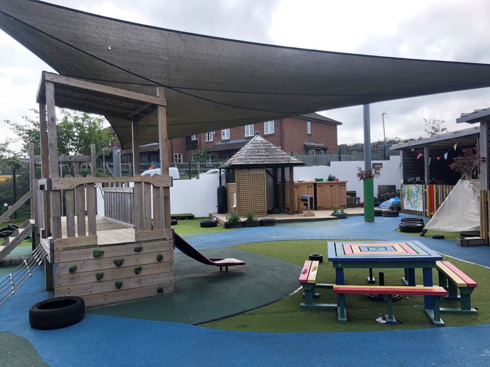"outdoor space with climbing apparatus and picnic table"