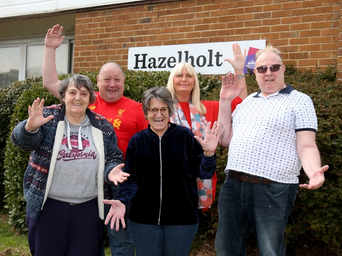 Residents stand in front of Hazelholt housing
