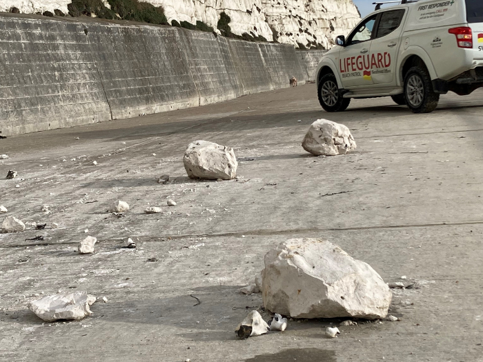 A picture of a car and boulders