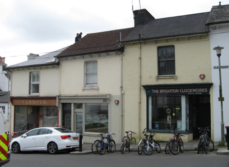 Terraced buildings, which step up the hill with staggered roofline. 