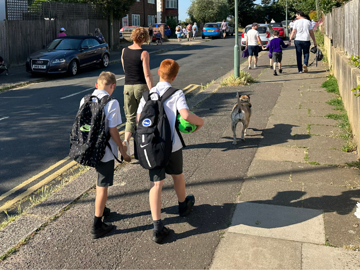 children and parents walking to school