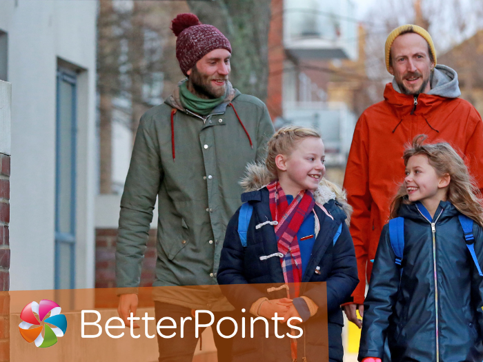 Two men and two children walking with the word 'Betterpoints' underneath
