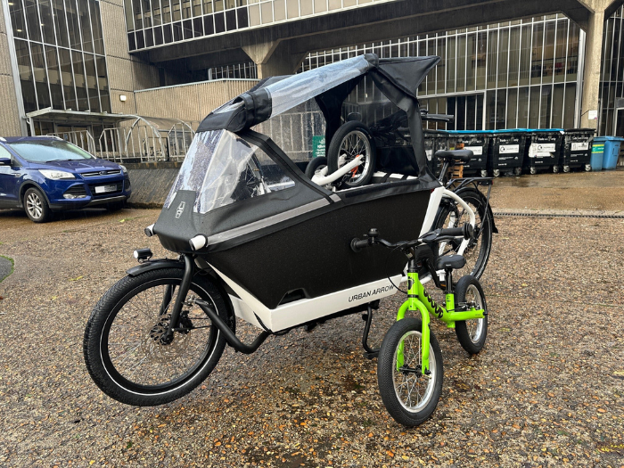 A picture of an e-cargo bike and a balance bike