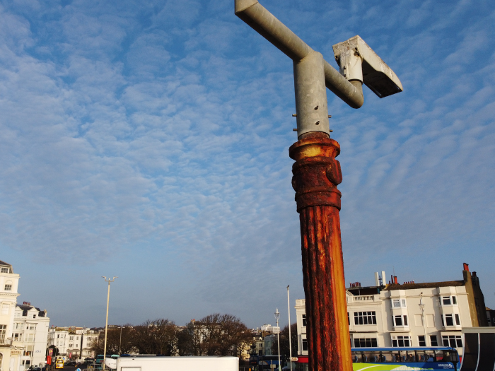 A picture of a rusted lamppost