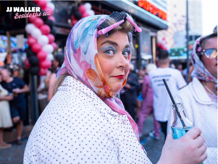 A picture of a person in a headscarf and makeup