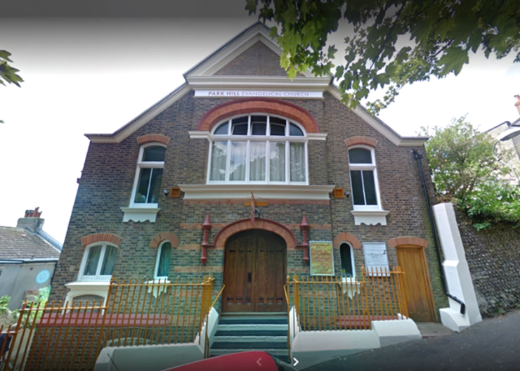 Street frontage of the Church with the central raised entrance.