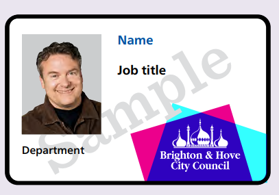 A white ID card. The left hand side of the card has a photo of the carrier, and below the photo will be the name of their department. To the right of this will be their name in blue text and, under that, their job title. The logo of Brighton & Hove City Council is in the bottom right corner - a white silhouette of the pavilion over an overlapping purple, blue and turquoise square design.