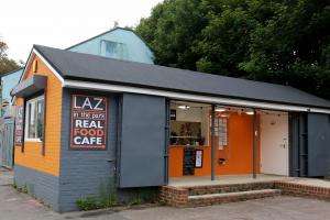 Laz in the Park cafe. Grey and orange building.