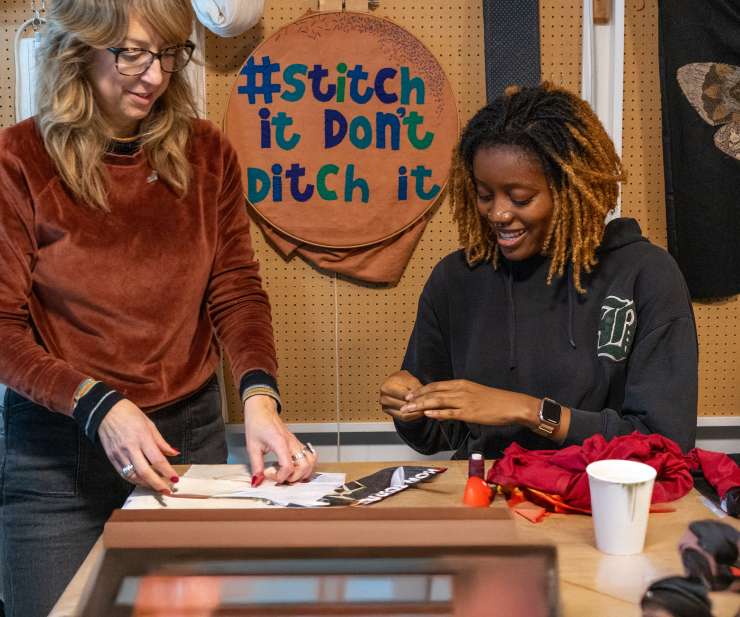 Photograph of two people at Sew Fabulous, an organisation that increases skills and knowledge of sustainable textiles