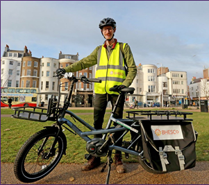 BHESCo employee standing with eCargo bike