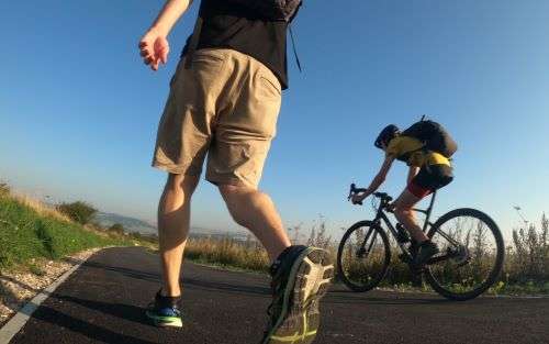 View from a path in the downs of a walker and a cyclist.