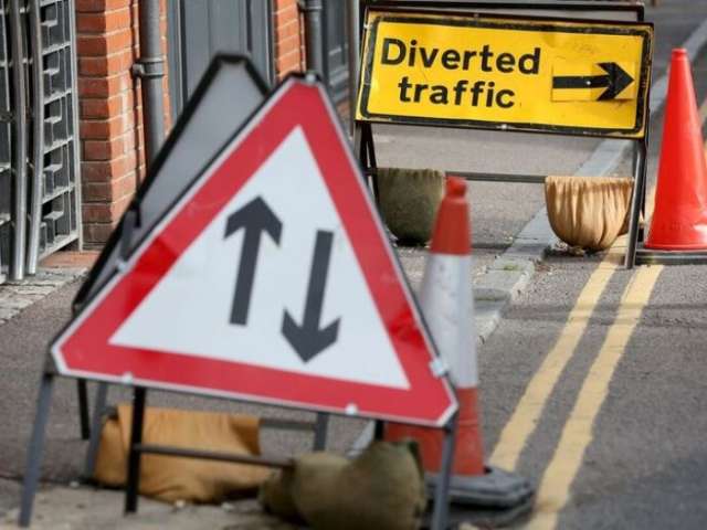 Diverted traffic and two-way signs by the side of the road