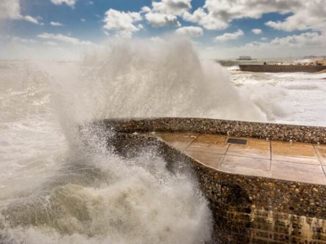 Wave crashing into the seafront