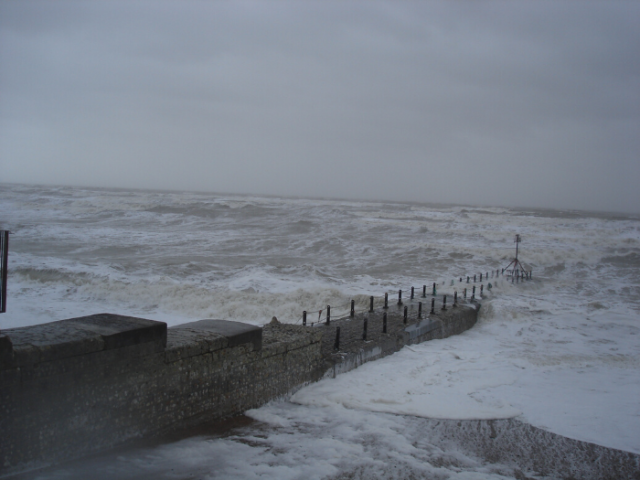 Waves crashing against a groyne in Hove