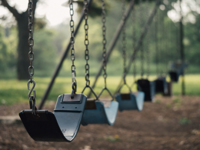 empty swings in a playground