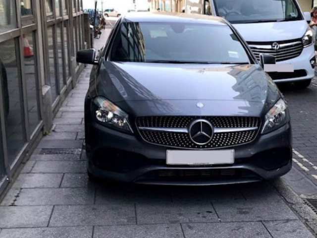 A car parked on a pavement