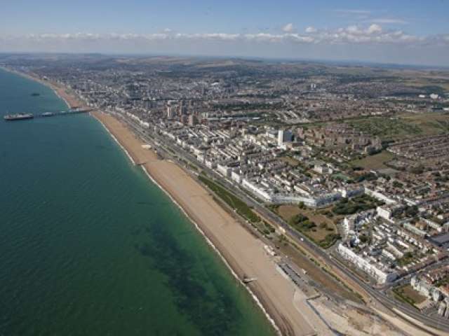 Aerial shot of Brighton showing the shoreline and the sea