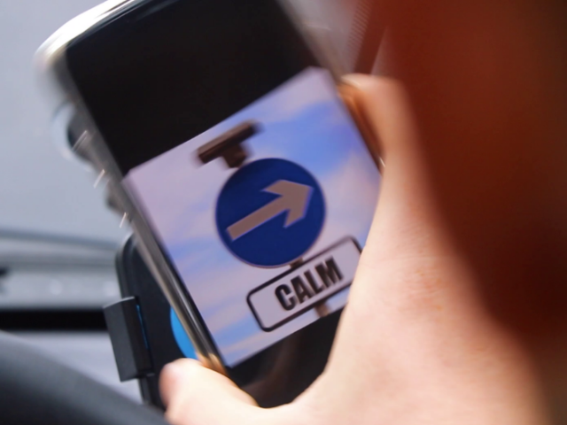 Picture of a phone with a 'one-way' sign which reads "Calm"