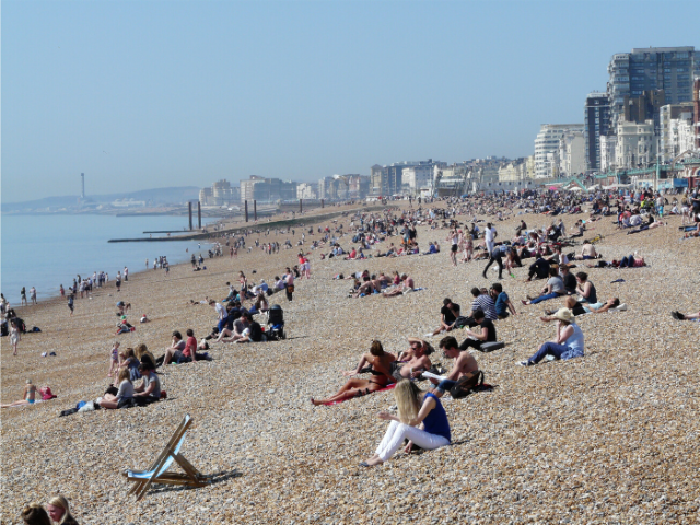 People sitting on Brighton beach