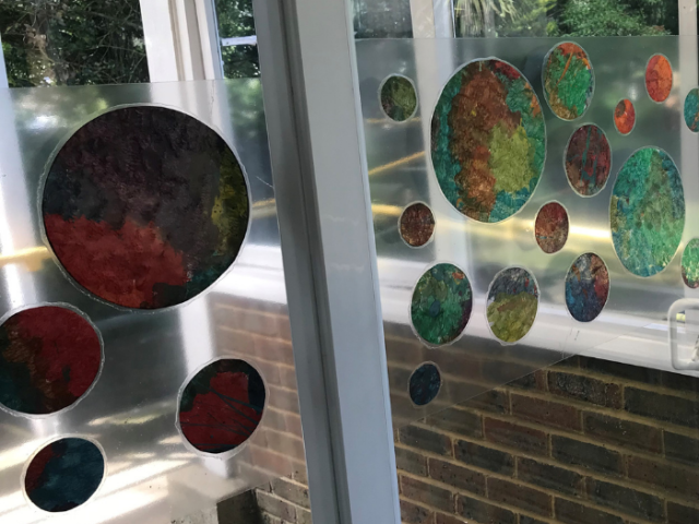 Artwork created at Preston Drove. Abstract images on a glass door.