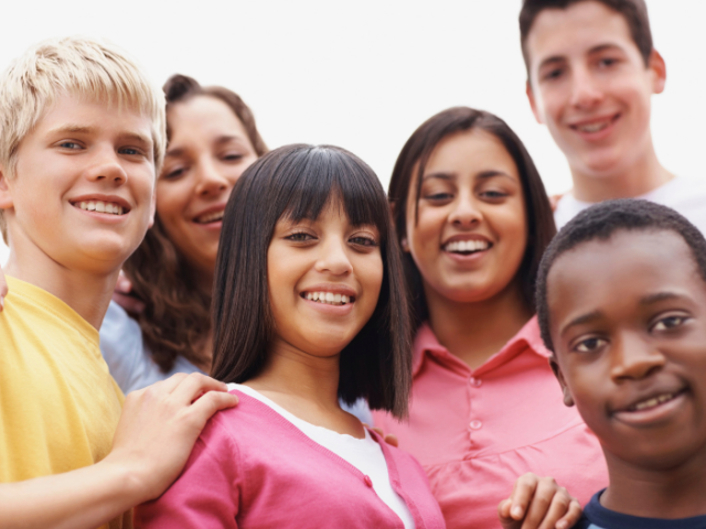 Group of young people of mixed ethnicity smiling  