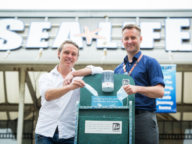 Cllr Jamie Lloyd and SEA LIFE centre manager Neil Harris try out the new  PPE recycling bins