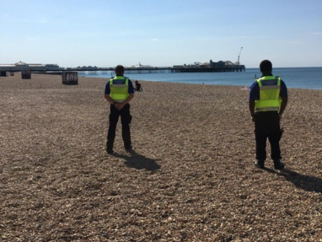 Image of council environment enforcement officers on the beach