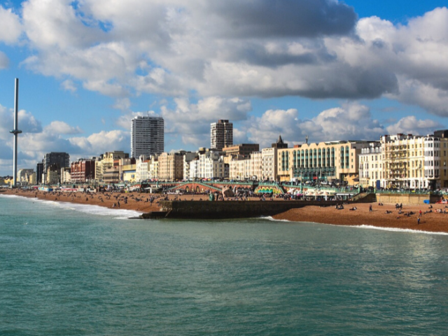 View of Brighton seafront looking west towards the i360 with the sea in the foreground 