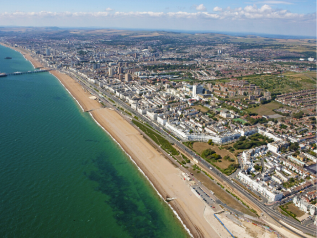 An ariel view of a city, beach and sea