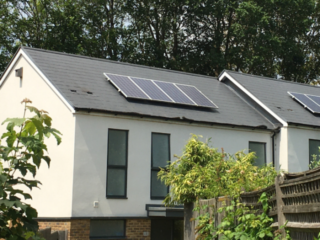 A home with solar panels on the roof in Brighton & Hove