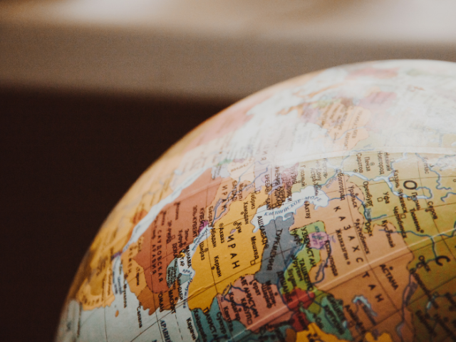 Part of a globe showing countries in different colours