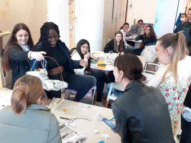 Year 9 pupils from Cardinal Newman School with local business Rubymoon, in a workshop, handling and learning about textiles.