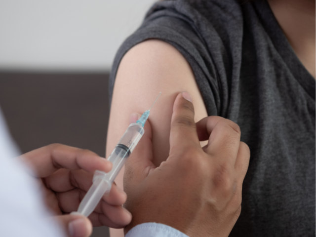 Person receiving a Covid Vaccination