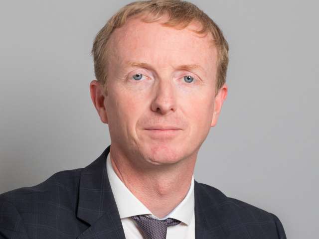 Head and shoulders photograph of Nick Hibberd