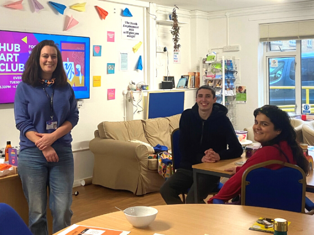 Youth advisor poses with two young people at the Youth Employment Hub
