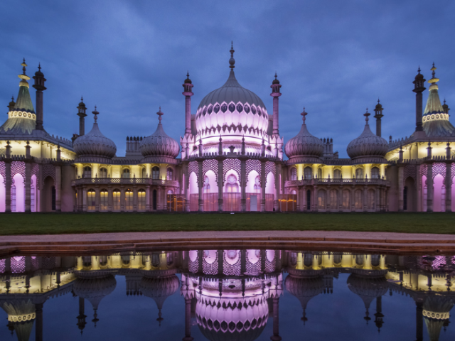 Photograph of The Royal Pavilion lit up at night 