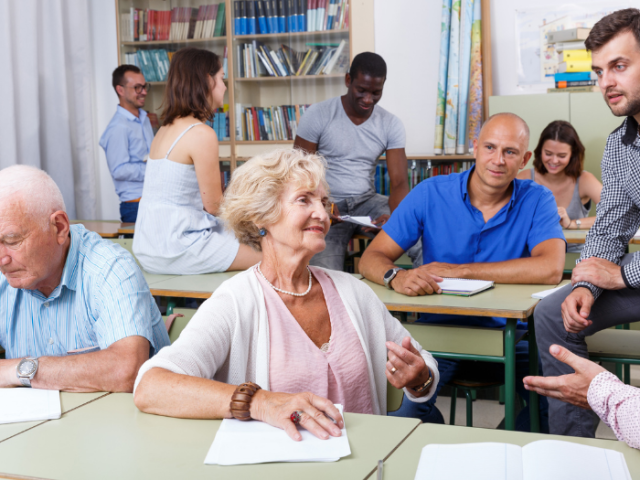 Image of mixed group of adults in a classroom setting