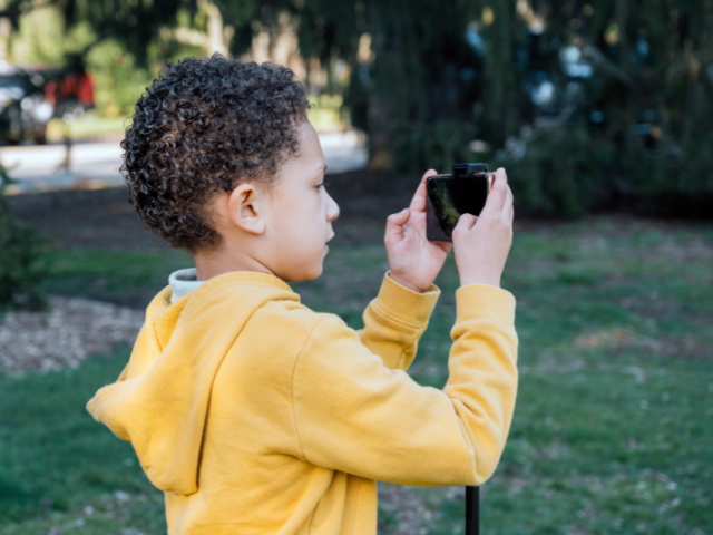 Picture of a child taking a photo
