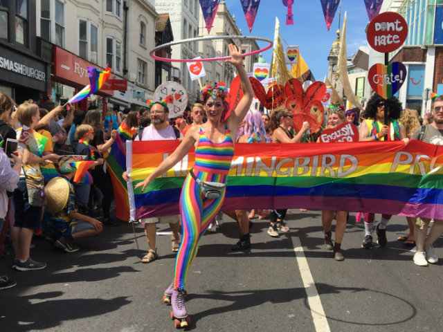 Pride parade and revellers going through North Street in Brighton