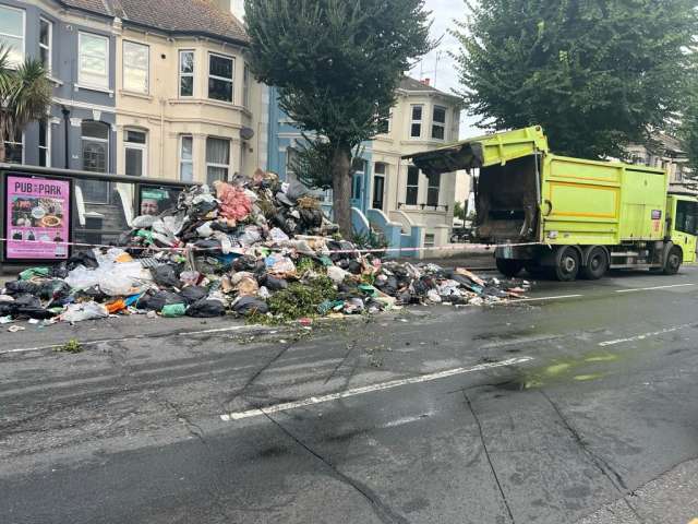 Image showing rubbish emptied out of a refuse truck onto the street