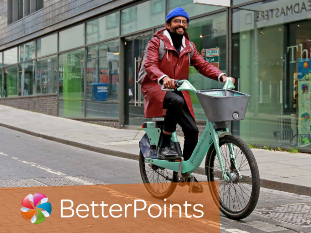 A man riding a bike with the word 'BetterPoints' in caption