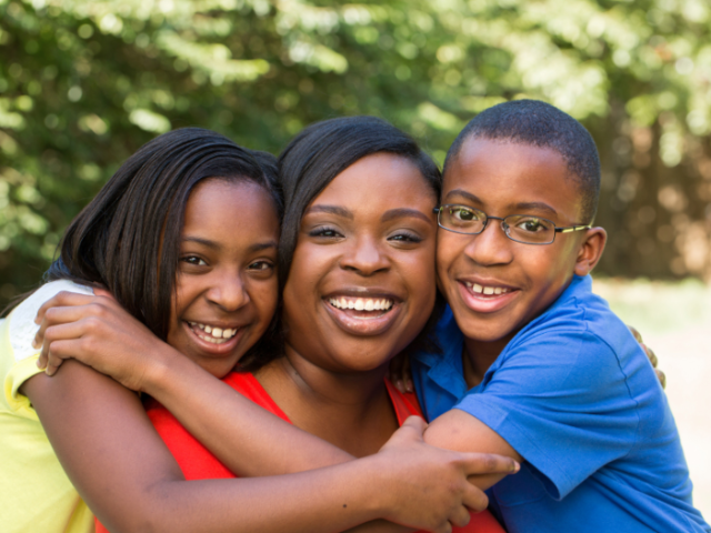 An image of a happy family showing children in care 