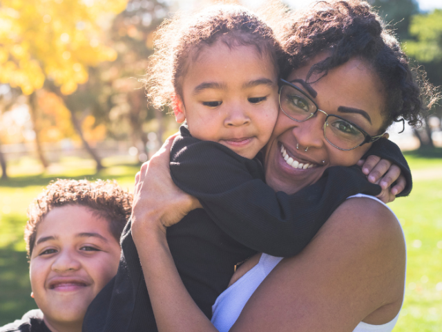 Photo of a mother and her children.