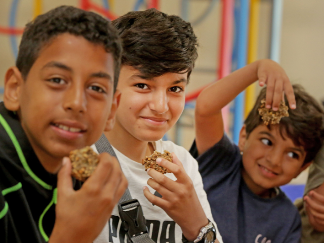 Children and young people enjoying a free healthy meal on the HAF programme.