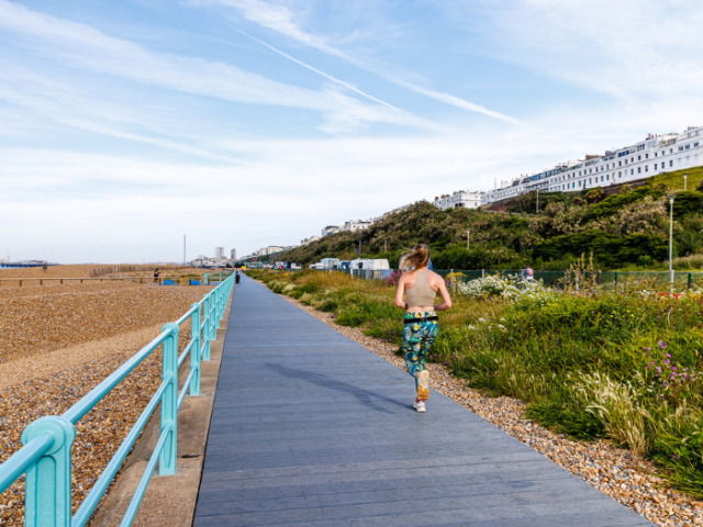 Picture of a runner on the boardwalk at Black Rock