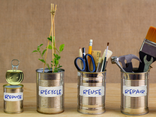 Picture of tin cans being used to demonstrate how to Reduce, Recycle, Re-use and Repair materials
