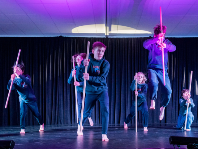 Photo of 6 young dancers holding sticks