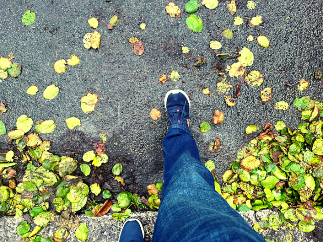 legs walking into a road