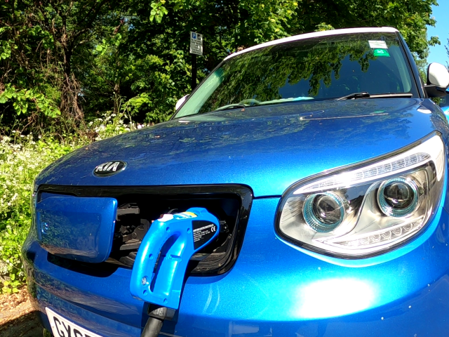 an electric vehicle being charged